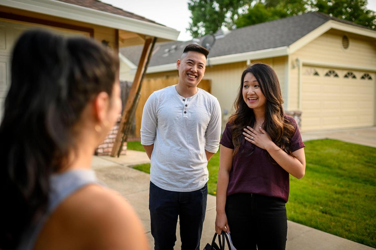Koy Saeteurn, 28, and husband Daniel Saechao, 29, talk to the seller of their new home, Waleska Banegas, in Elk Grove on Wednesday, May 29, 2019. The couple wrote a “love letter” to the seller about the home and their plans for it that included photos of their wedding and their dog.