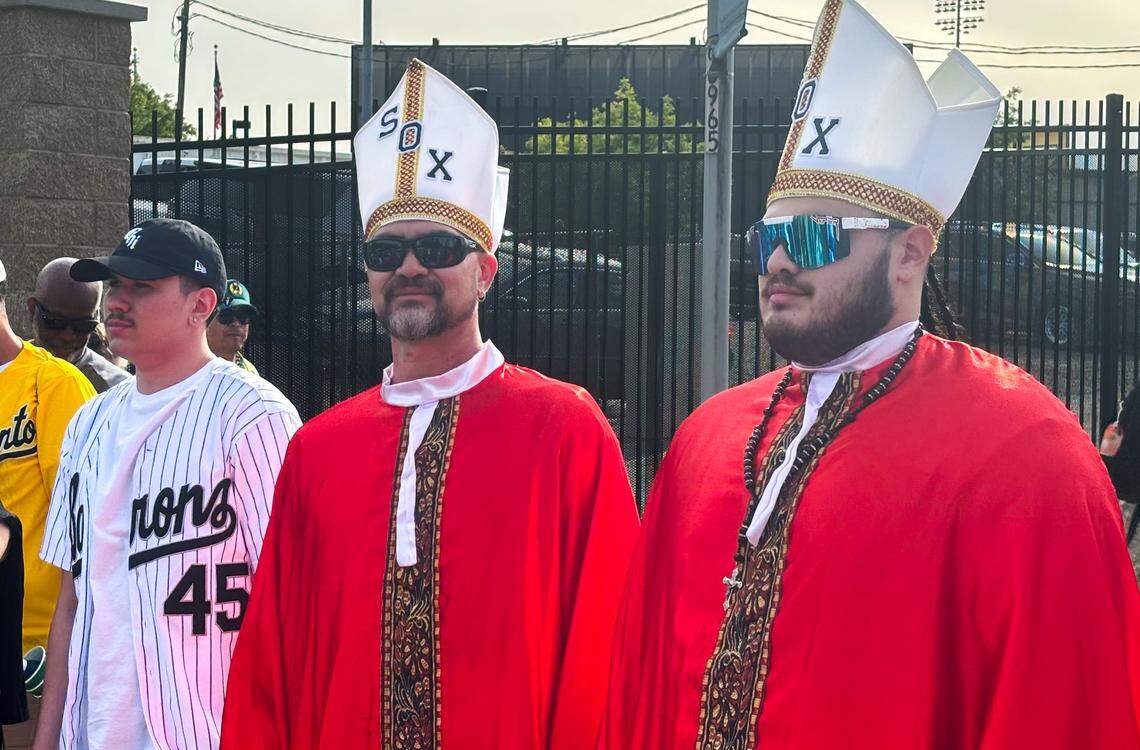 Oscar and Tristan Perez dress in papal garb – a reference to suburban Chicago native Pope Leo XIV –&nbsp;as they attend an Athletics game against the Chicago White Sox in West Sacramento on Saturday.