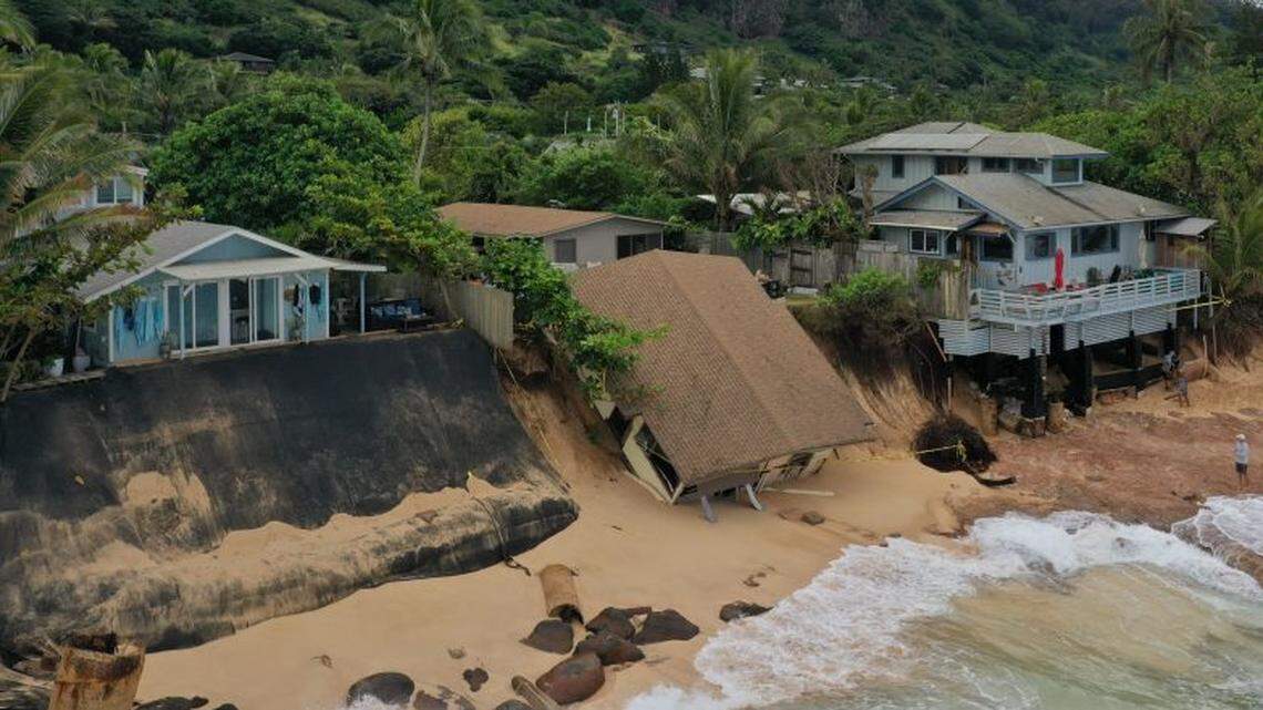 A home on Hawaii’s North Shore collapsed as high surf and rising oceans eroded the beach beneath it, state officials say. No one was hurt.