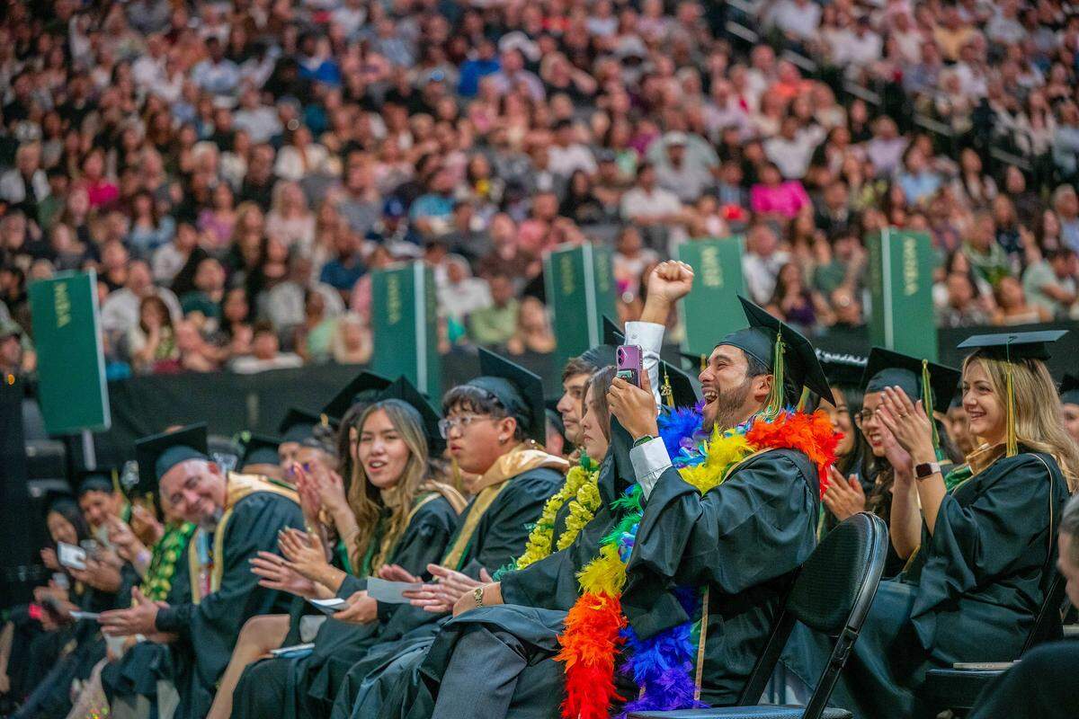 Richard Kiki Angulo, executive vice president of Associated Students Inc., celebrates after his name is called during one of Sacramento State’s commencement ceremonies at Golden 1 Center on Friday. His is  part of the largest graduation class in the university’s history.