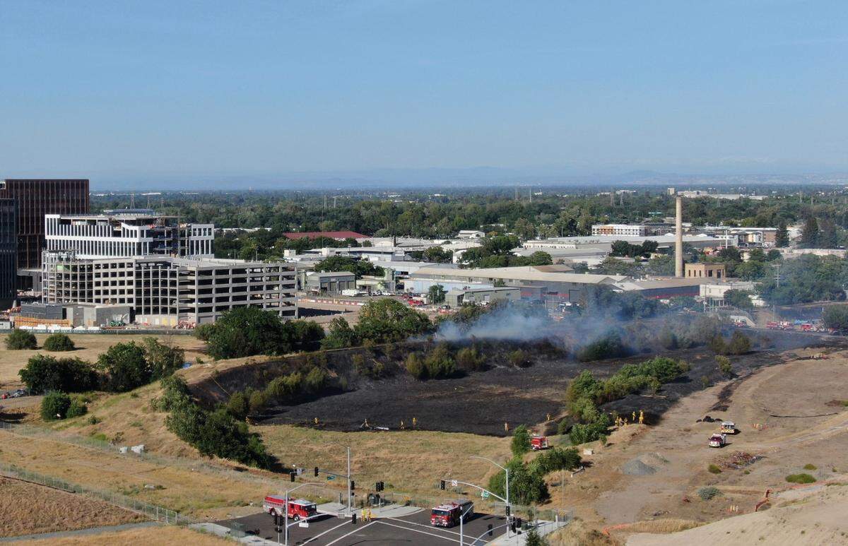 Firefighters respond to a 45-acre blaze near the Sacramento Railyards as high winds swept through Sacramento Friday during a red flag warning.