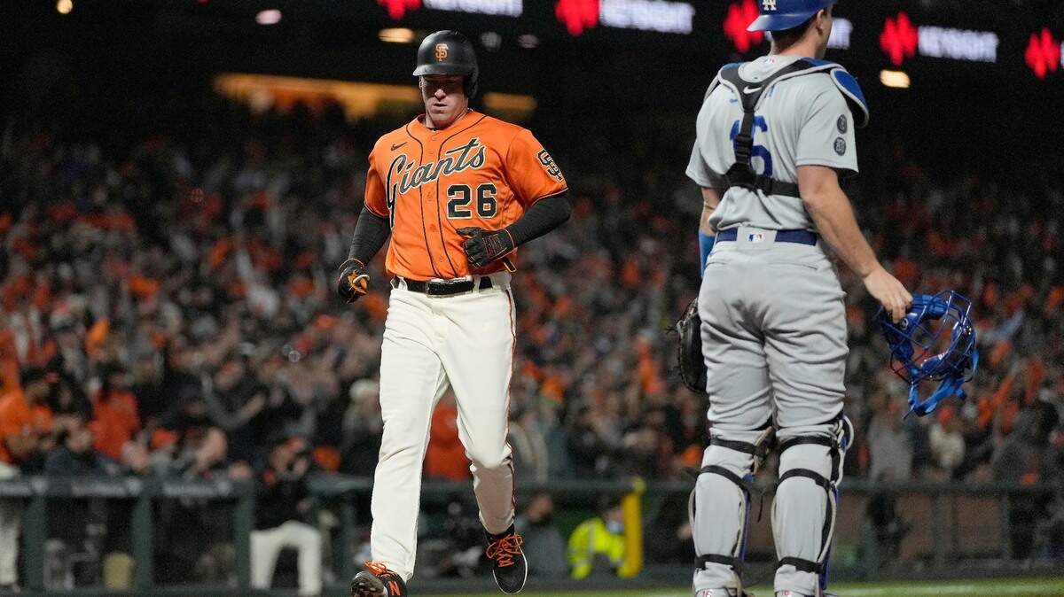 San Francisco Giants’ Anthony DeSclafani (26) scores a run past Los Angeles Dodgers catcher Will Smith (16) on a single by Austin Slater during the third inning of a baseball game Friday, Sept. 3, 2021, in San Francisco.