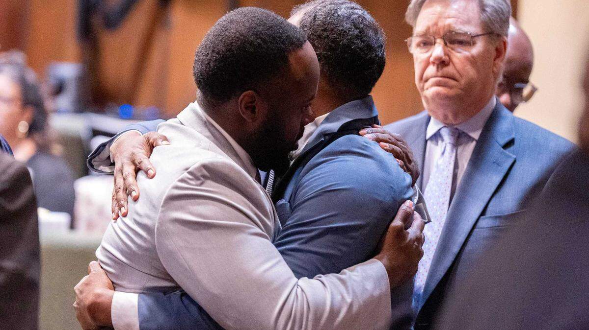 Former Memphis police officers Tadarrius Bean, left, and Justin Smith hug after being acquitted of all charges by a jury on the ninth day of their state trial in Memphis, Tenn., on May 7, 2025. The two were among three officers acquitted in state court in the fatal January 2023 beating of Tyre Nichols.