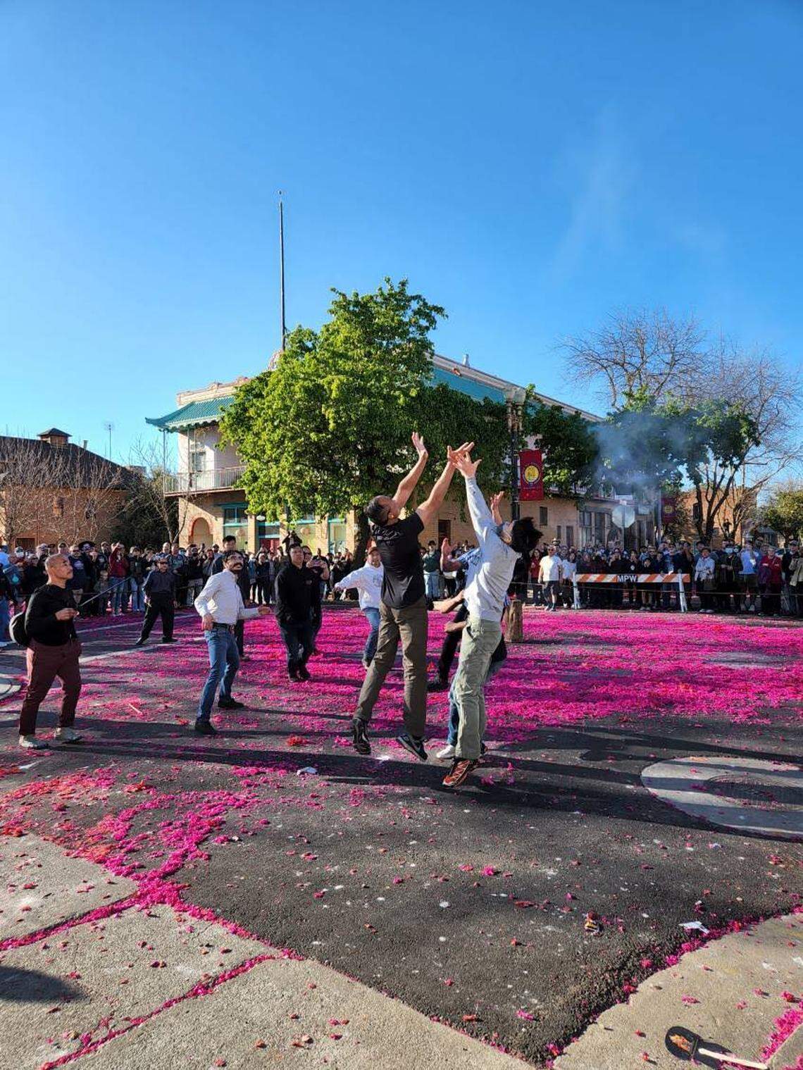 Participants vie for a ring shot during the “firing of bombs” of the Bok Kai celebration in Marysville on March 6, 2022.