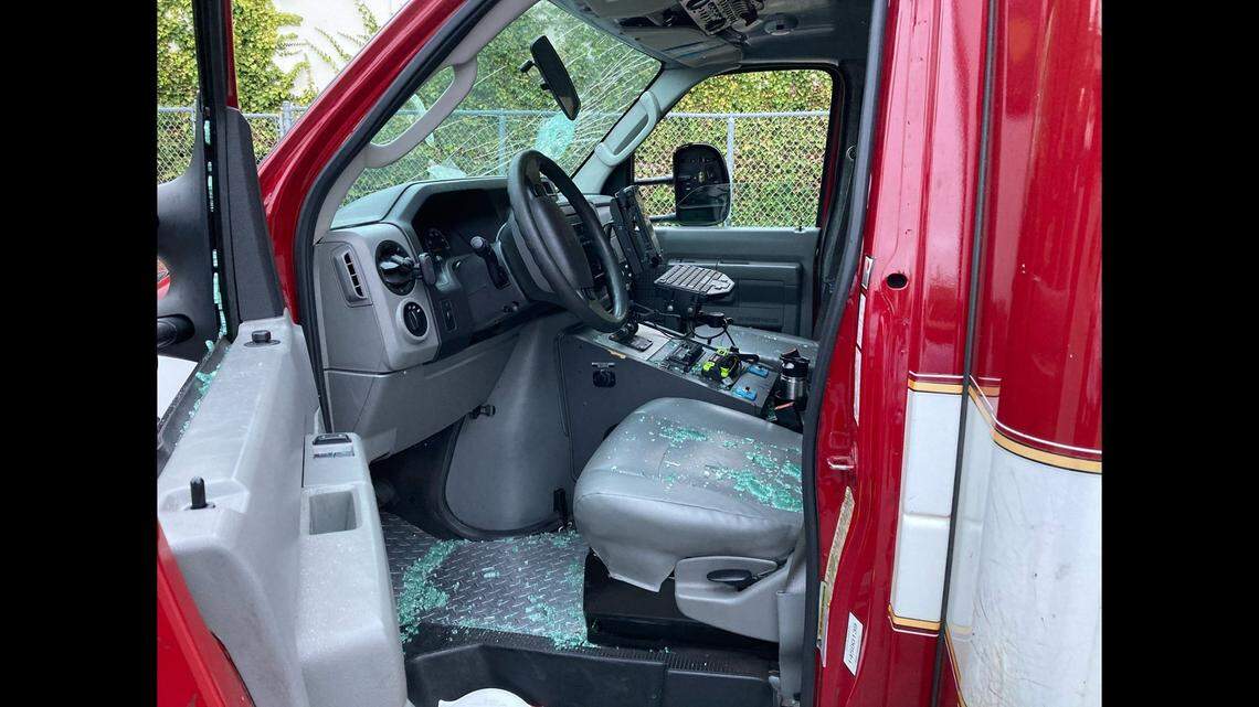 Firefighters fled a parked ambulance when an attacker broke the windows, then stole it and chased them in a San Francisco parking lot, California police say.