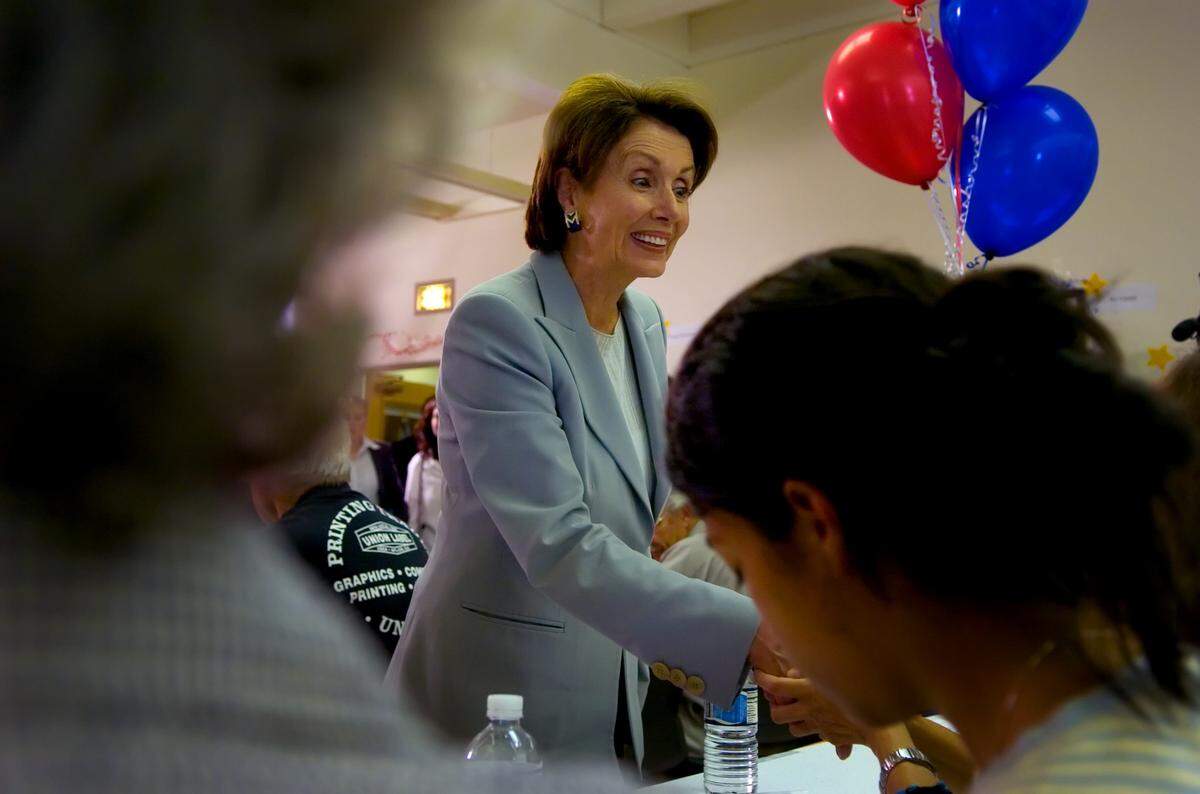 House Minority Leader Nancy Pelosi greets supporters at a phone bank at the Sacramento City Teachers Association on Oct. 18, 2006.