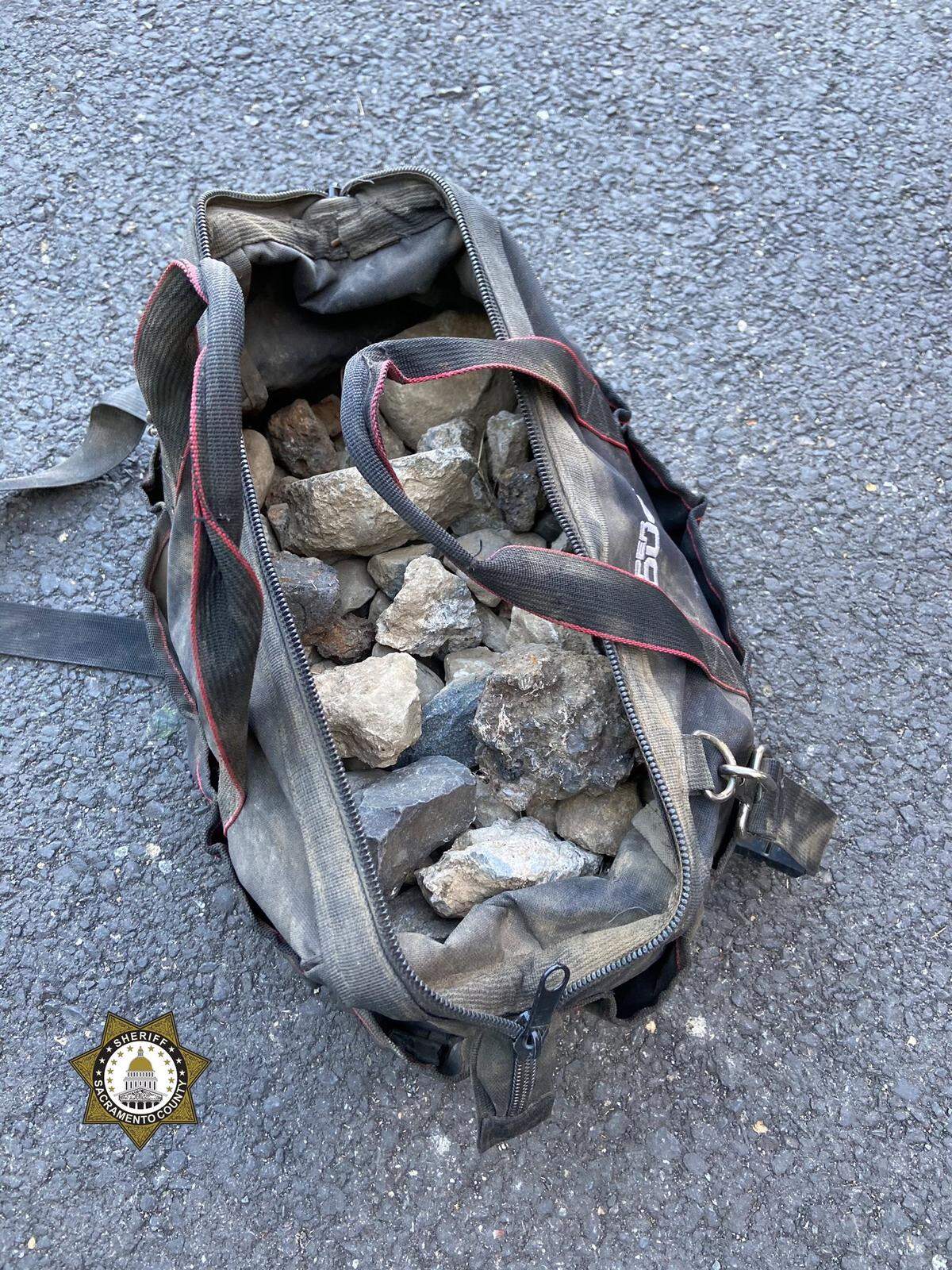 A deputy found a bag of rocks outside a government building on the day of protests.