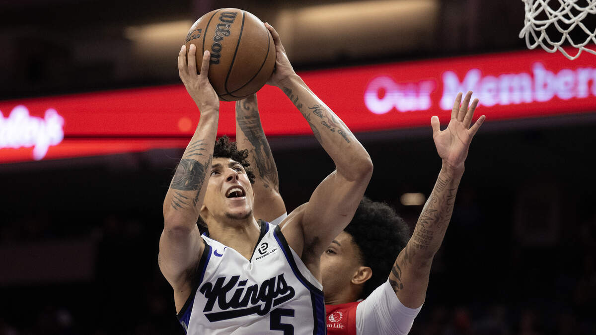Toronto Raptors guard Chucky Hepburn (24) defends Sacramento Kings guard Nique Clifford (5) as he shoots in the second half on Wednesday, Oct. 8, 2025, in Sacramento.