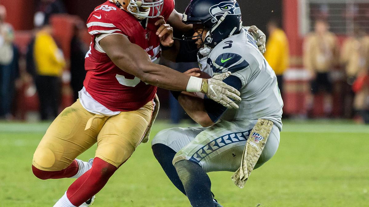 San Francisco 49ers’ Ronald Blair III (98) sacks Seattle Seahawks starting quarterback Russell Wilson (3) in the fourth quarter and is injured on the play during a game at the Levi’s Stadium on Monday, November 11, 2019 in Santa Clara.