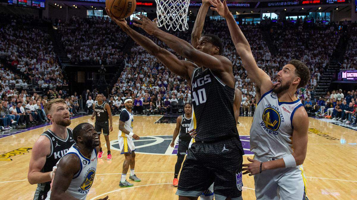 Sacramento Kings forward Harrison Barnes (40) scores a basket defended by Golden State Warriors guard Klay Thompson (11) during Game 1 of the first-round NBA playoff series at Golden 1 Center on Saturday, April 15, 2023.