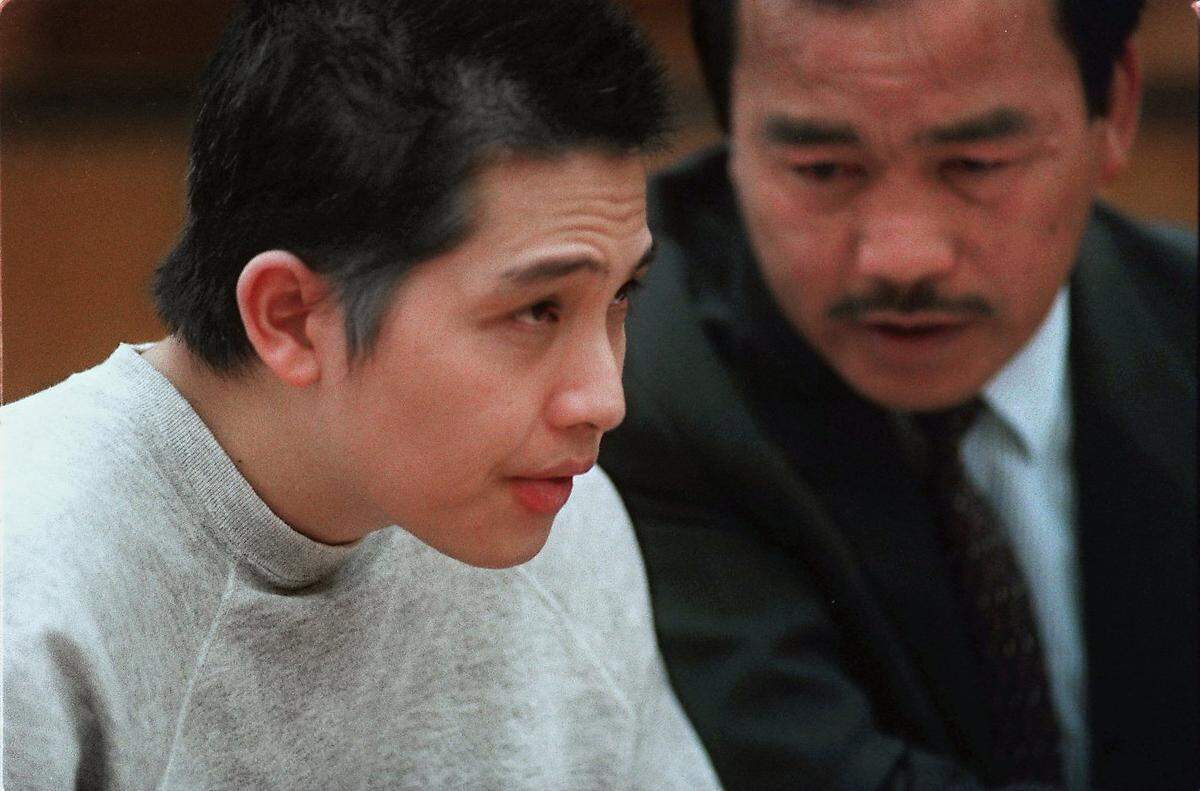 Loi Khac Nguyen, left, speaks with Vietnamese interpreter Duc Nguyen, no relation, during sentencing proceedings in Sacramento Superior Court on July 17, 1995. Judge W.J. Harpham sentenced Nguyen to 49 consecutive life terms for his role in the Good Guys hostage incident on counts that included murder, attempted murder, kidnapping and gun violations.