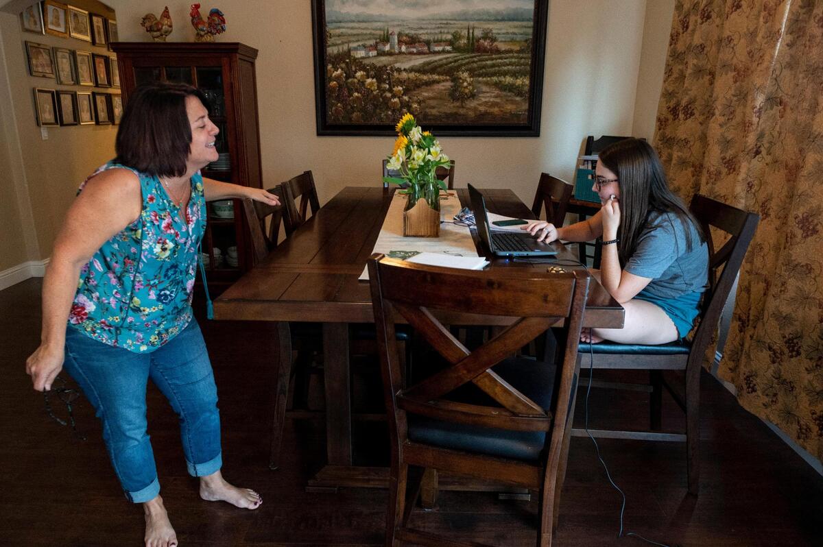 Amy Jacobsen, a fourth grade teacher at John Reith Elementary School in Elk Grove, takes a break in between classes and jokes with her daughter, Abigale, 16, who is in her junior year and attending school remotely, in their home in Elk Grove on Monday, Sept. 14, 2020.