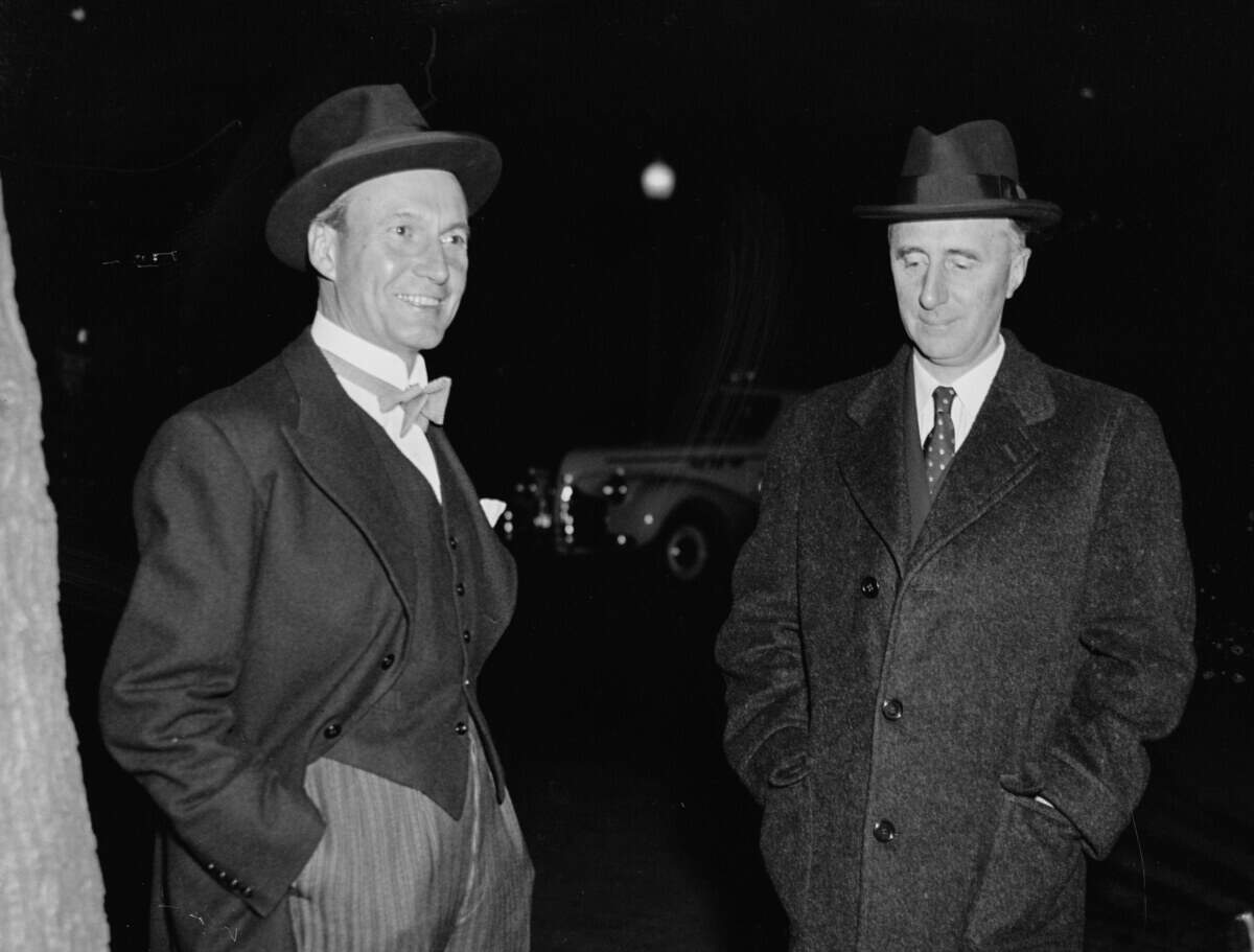 Danish Minister Henrik De Kauffmann, left, and Norwegian Minister Wilhelm Munthe de Morgenstierne arrive at the Soviet Embassy in Washington, D.C., for a reception in November 1939.