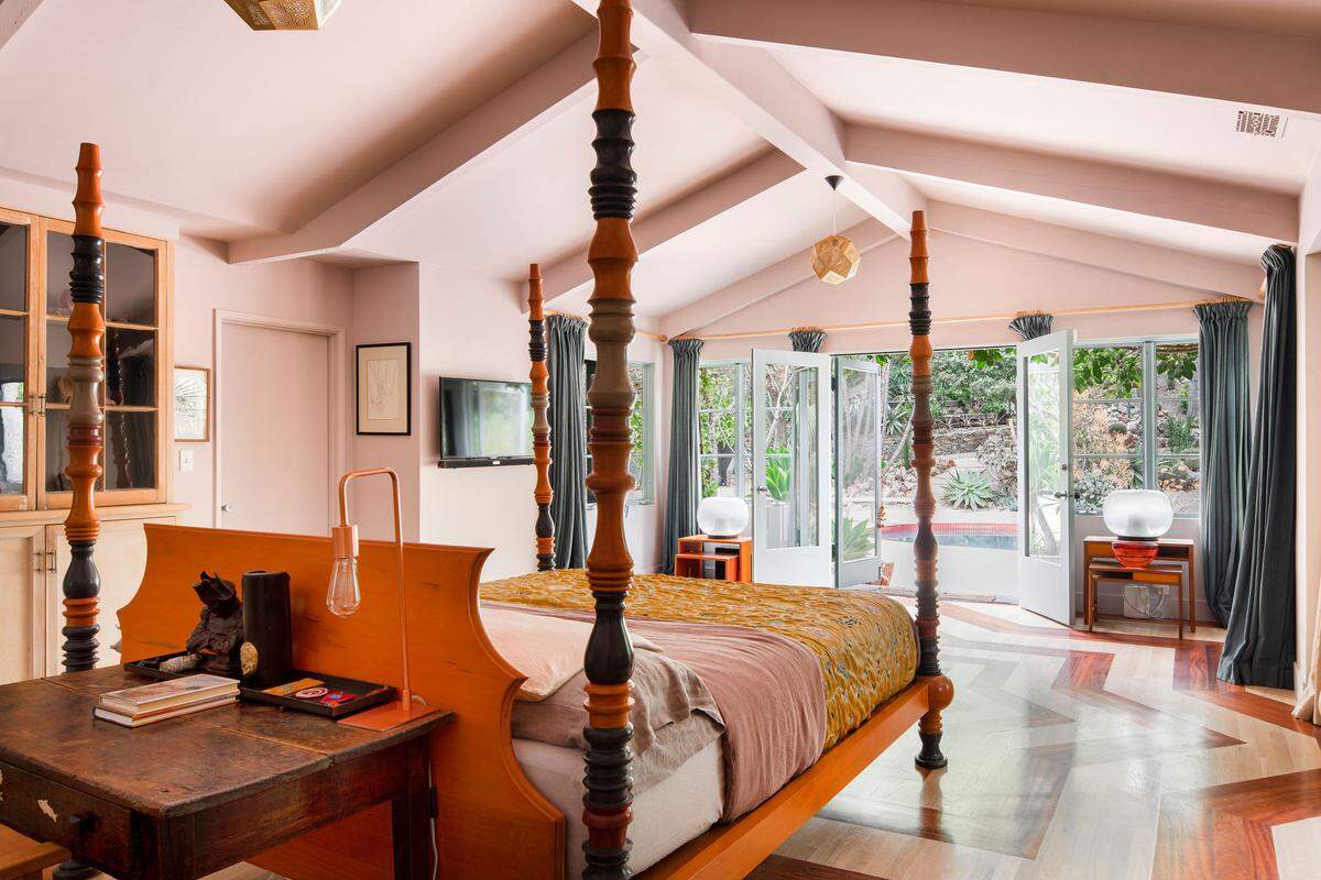 There’s 6,350 square feet of living space on 1.73 acres, as two ranch homes combine into a single flowing estate. The property offers four bedrooms, six bathrooms with the main house featureing three bedroom suites and a separate one-bedroom guesthouse.