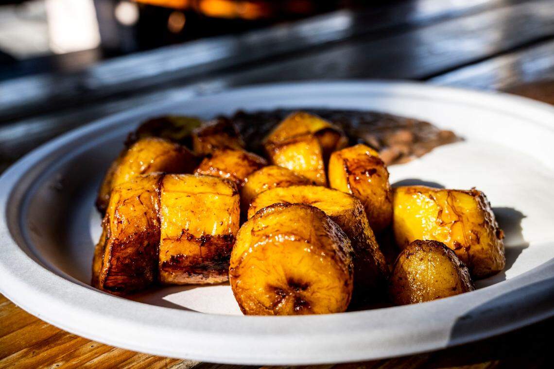 A plate of cinnamon-dusted sweet plantains served with the traditional fried beans and cream at Pupusería La Chicana in Woodland in 2022.