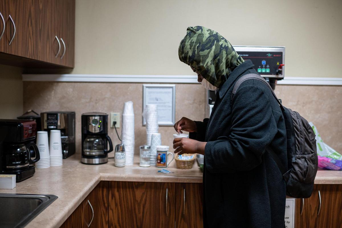 Mahogany Lenard prepares hot coffee after traveling from downtown Sacramento to stay overnight at Elk Grove United Methodist Church, a recently opened Elk Grove Overnight Warming Center, on Friday, Dec. 10, 2021, at 8986 Elk Grove Blvd. The shelter is open through Tuesday at the church for people experiencing homelessness or inadequate heat in their home.