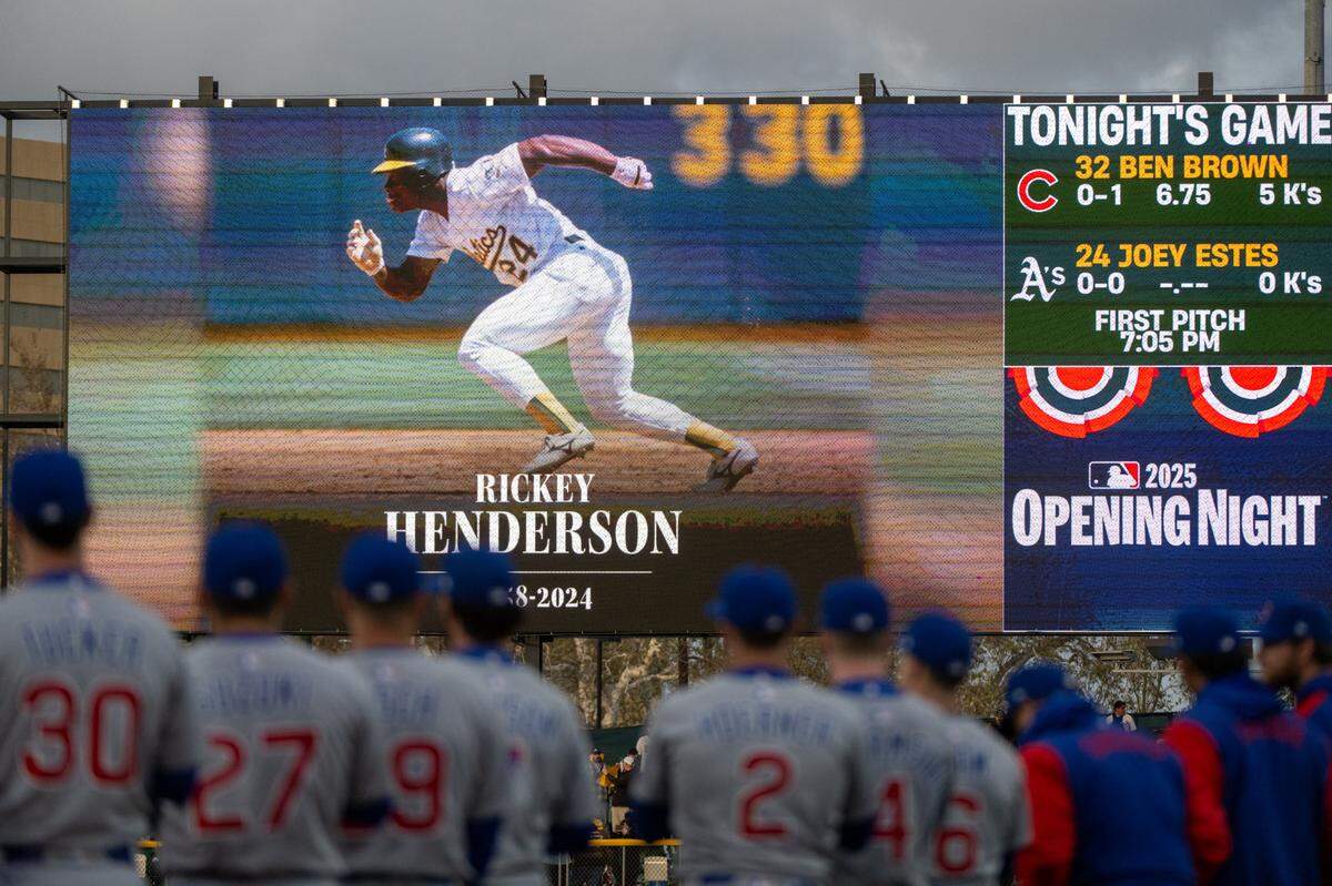 Chicago Cubs players watch a tribute to Oakland A’s legend Ricky Henderson during the opening ceremony for the first Major League Baseball game at Sutter Health Park on Monday.