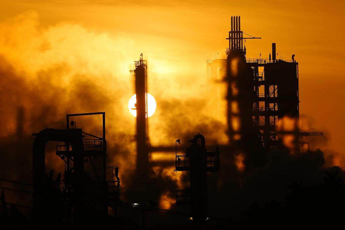 The Phillips 66 refinery looms in 2016 over a Wilmington neighborhood where some long-time residents feel their health issues might stem from their proximity to the refinery. The Union Oil Company of California built the original refinery in 1919 between the old Anaheim road and the port, years before homes were constructed to form the neighborhood.