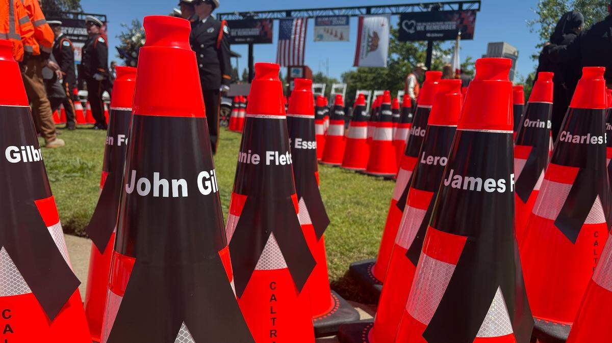 One hundred and ninety-five orange traffic cones were placed in a diamond shape in the middle of the California Department of Transportation’s 36th annual workers memorial event on Thursday. Each cone represents a California highway maintenance and construction worker that has died on the job since 1921 — when the first death was recorded. For this year’s memorial, one more orange traffic cone was added the diamond formation to represent the loss of Mahdi Khorram, a Caltrans District 4 transportation engineer.
