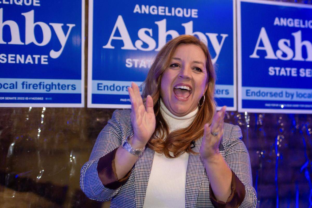 State Senate District 8 candidate Angelique Ashby claps before speaking at her election night party at Bella Bru Cafe in Natomas on Tuesday, Nov. 8, 2022. She led in early returns.