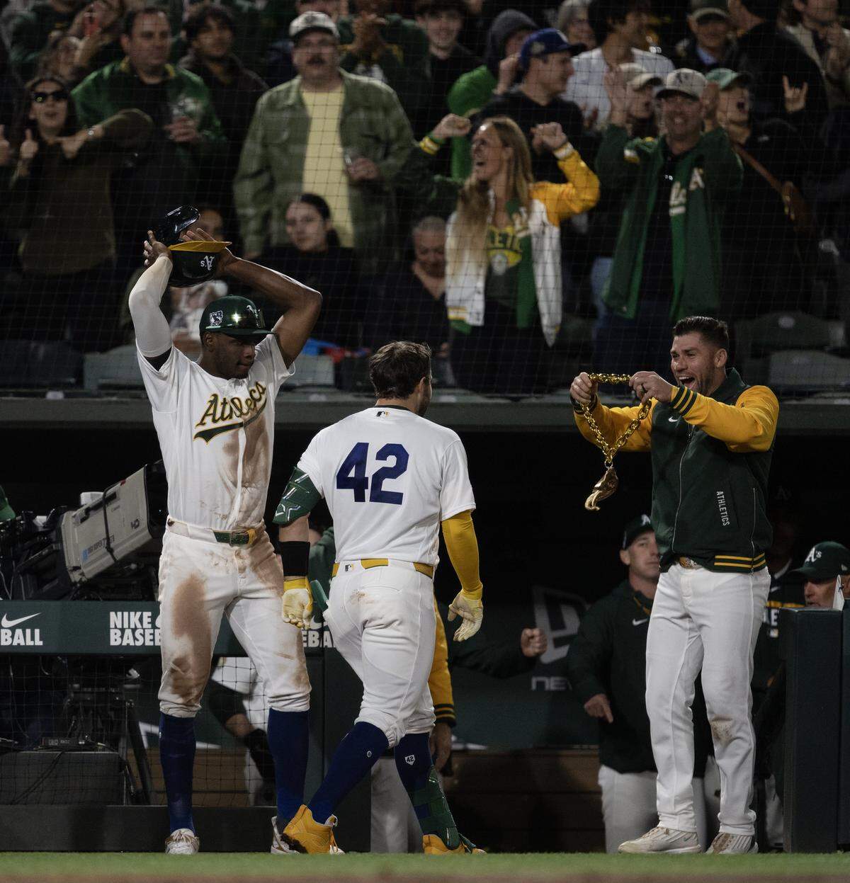 Athletics catcher Shea Langeliers is greeted at the A’s dugout after hitting a two run homer off Texas Rangers pitcher Cole Winn in the bottom of the sixth inning at Sutter Health Park on Wednesday in West Sacramento.