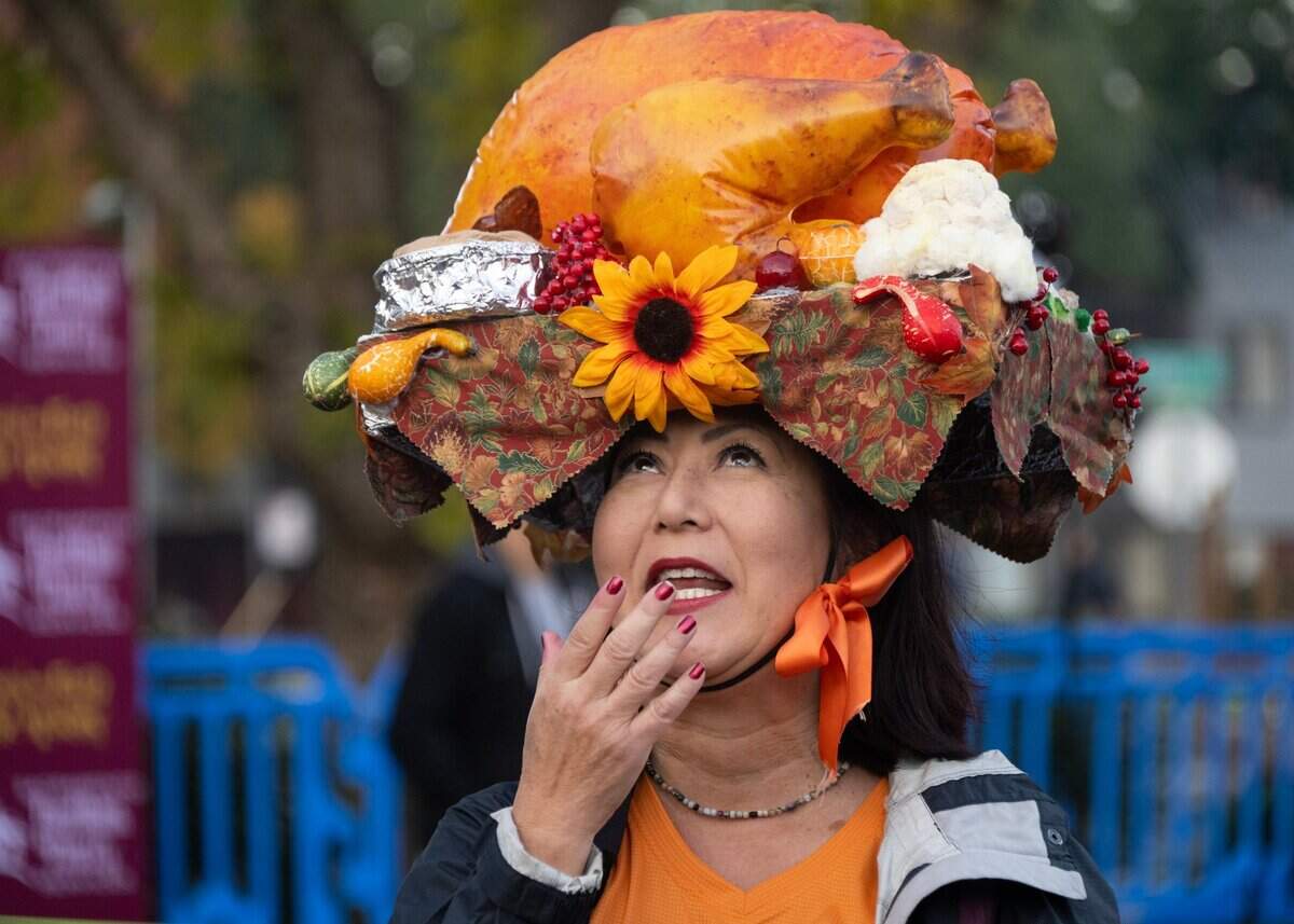 Hillary Sunada wears an inflatable turkey on her head as she waits to start the Run to Feed the Hungry in Sacramento on Thursday.
