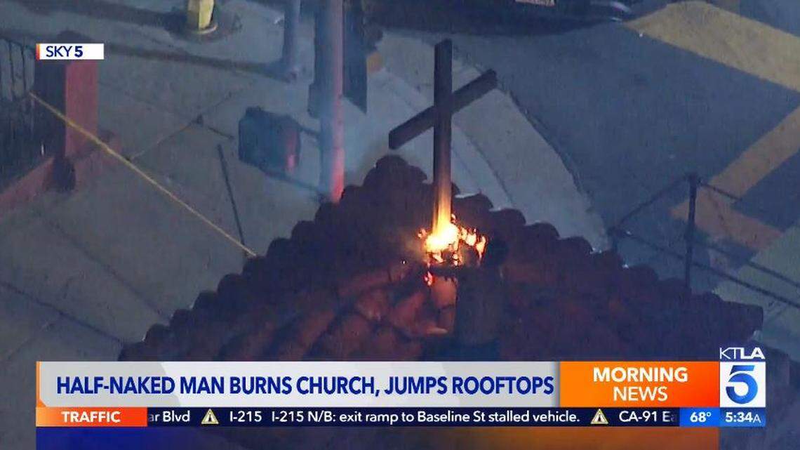 A half-naked man climbed St. Mary’s Catholic Church in the Boyle Heights neighborhood of Los Angeles, then set fire to a cross on the roof, police say.
