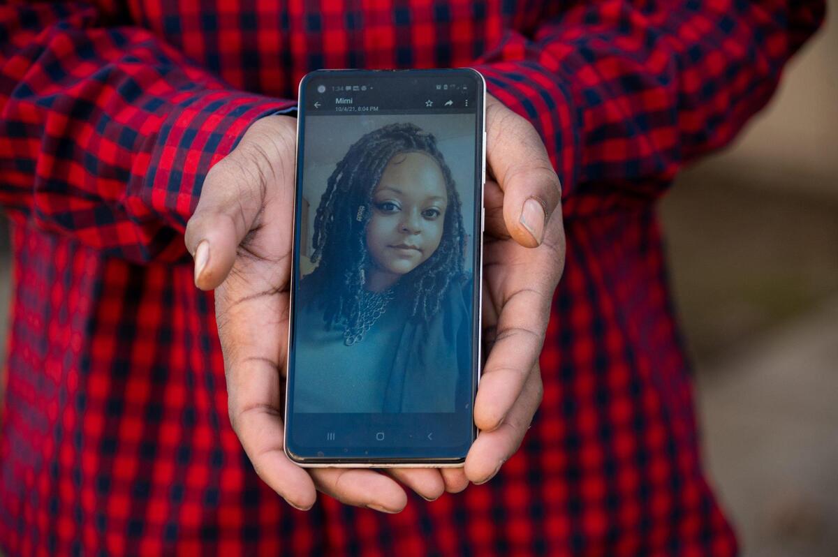 Ryan Vickers holds cellphone on Friday showing a photograph of his sister Mishila Vickers. She went into the Sacramento jail in December on a failure to appear charge and ended up in a catatonic state with COVID-19 and broken ribs.