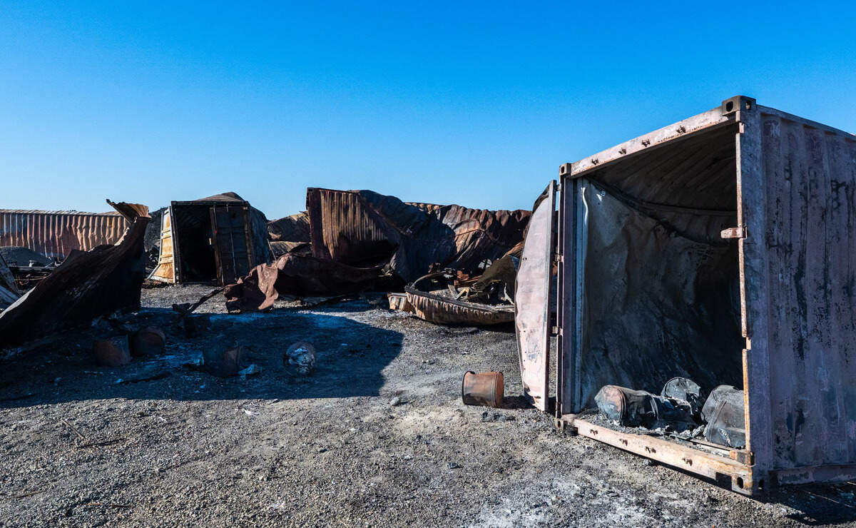 Drums of material rest inside a burned shipping container amid the wreckage of other containers at the Esparto fireworks explosion site on Friday, July 18, 2025.