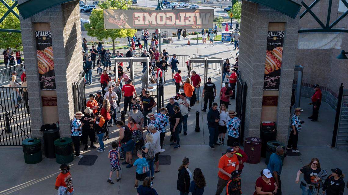 Fans enter the main entrance at the home opener against the Sugar Land Space Cowboys on April 5, 2022, at Sutter Health Park in West Sacramento. Birdies Social Club, an entertainment venue with golf simulators and a restaurant, is slated to open within a short walk of the ballpark on Riverfront Street around the same time MLB’s Athletics come to town in 2025.
