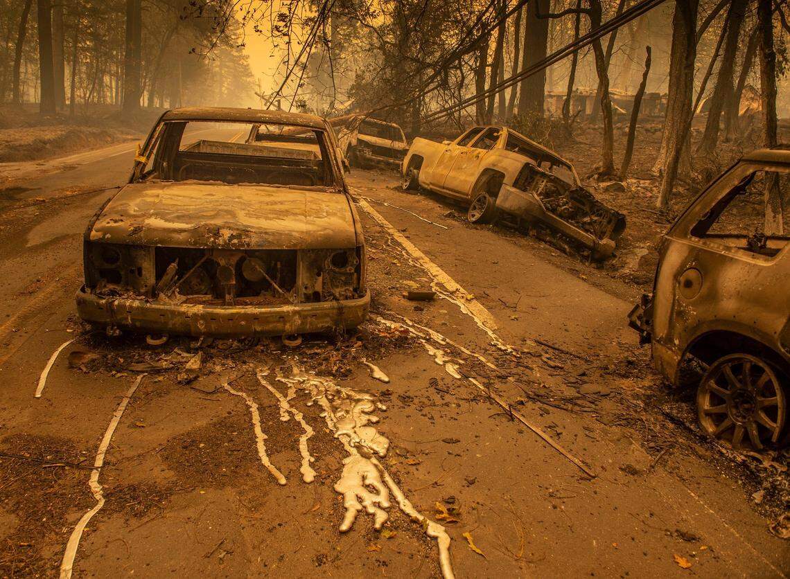 The charred remains of vehicles sit on Pearson Rd. on Friday Nov. 9, 2018.