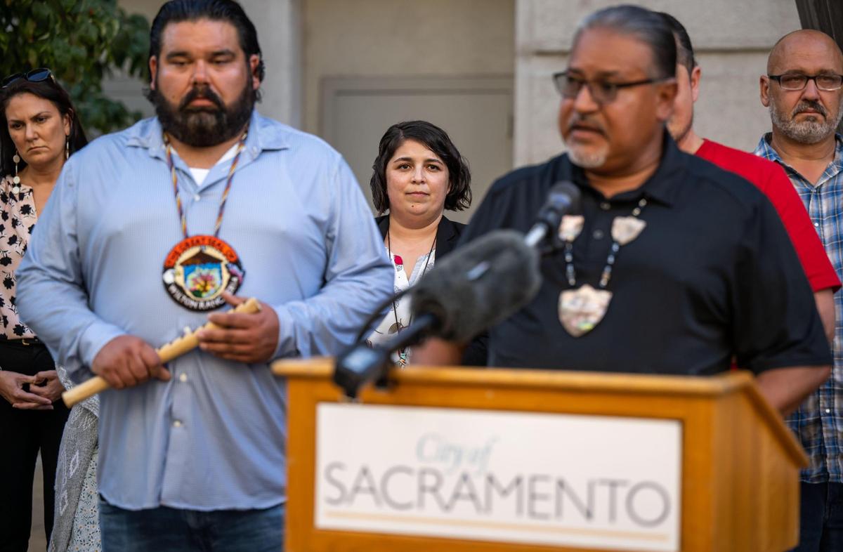 Sacramento City Councilwoman Katie Valenzuela, center, listens to tribal representatives speak during a press conference she called for Tuesday, Oct. 11, 2022, outside City Hall. She is calling for a disciplinary censure against Councilman Jeff Harris after an exchange they had regarding Indigenous Peoples Day and local tribes. Valenzuela, who is also calling for mandatory cultural competency training for city staff, added that Harris is also seeking Police Oversight Commissioner Keyan Bliss be stripped of his position.