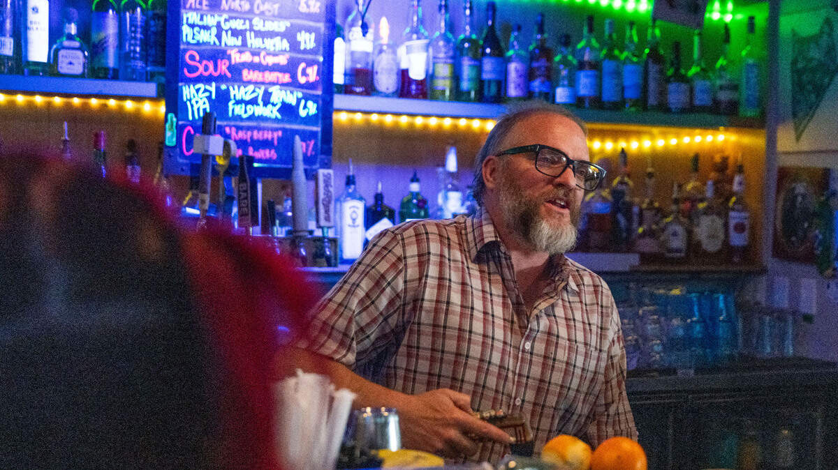 Josh Milholm, co-owner of the Golden Bear in midtown, pours a drink for a customer on Saturday, April 12, 2025. His business supports a proposal the Sacramento City Council will consider that would allow bars and restaurants to sell open containers of alcohol for patrons to take out onto streets during designated events. “It’s going to bring a wider group of people,” he said. 
