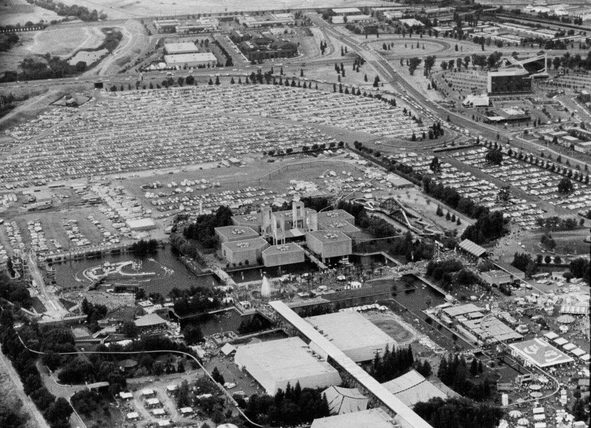 The Cal Expo parking lots are full for the California State Fair on Aug. 28, 1982, before the construction of a water slide park near the back of the site. Also visible is the log ride –&nbsp;the only permanent ride to be constructed at Cal Expo – which opened in 1971 and was removed after the 1989 fair.  