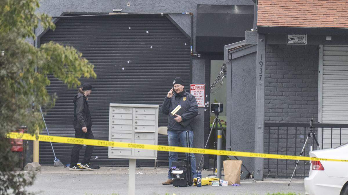 An ATF officer talks on his cellphone Sunday, Nov. 30, 2025, at the site of a mass shooting near Stockton the night before. Authorities said four were killed and 11 were injured in the shooting outside a child's birthday party.