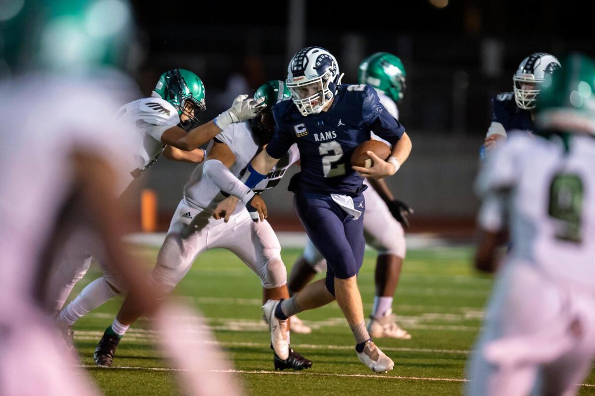 Casa Roble Rams quarterback Jason Lindahl (2) runs during a Sac-Joaquin Section Division V first-round playoff game in Orangevale on Nov. 5. Lindahl is The Bee’s Small School Player of the Year.