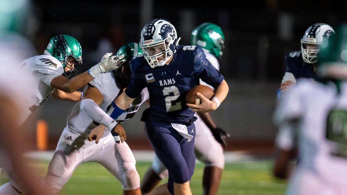 Casa Roble Rams quarterback Jason Lindahl (2) runs the ball during the third quarter in the CIF Sac-Joaquin Section Division V first-round playoff game at Casa Roble High School in Orangevale on Friday, Nov. 5, 2021. The Rams won 51-34.