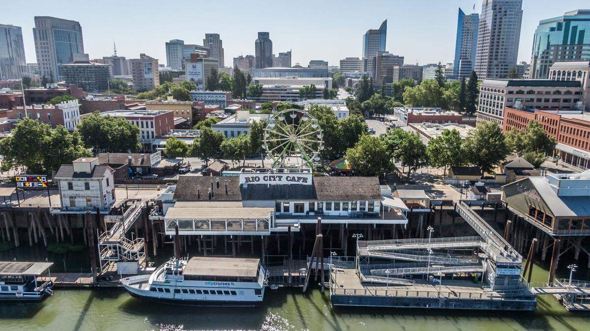 The Sacramento River flows by the Rio City Cafe on Wednesday, June 12, 2024. The Old Sacramento restaurant, which rents its property from the city of Sacramento, has lost the use of its popular deck because of its landlord’s failure to make necessary repairs.