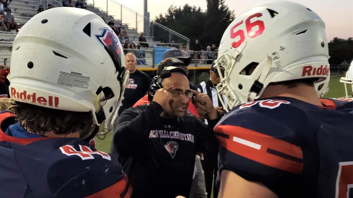 Vacaville Christian football coach Manny Tarango directs his players during a 34-0 home win over Lower Lake on Friday, Sept. 3, 2021.