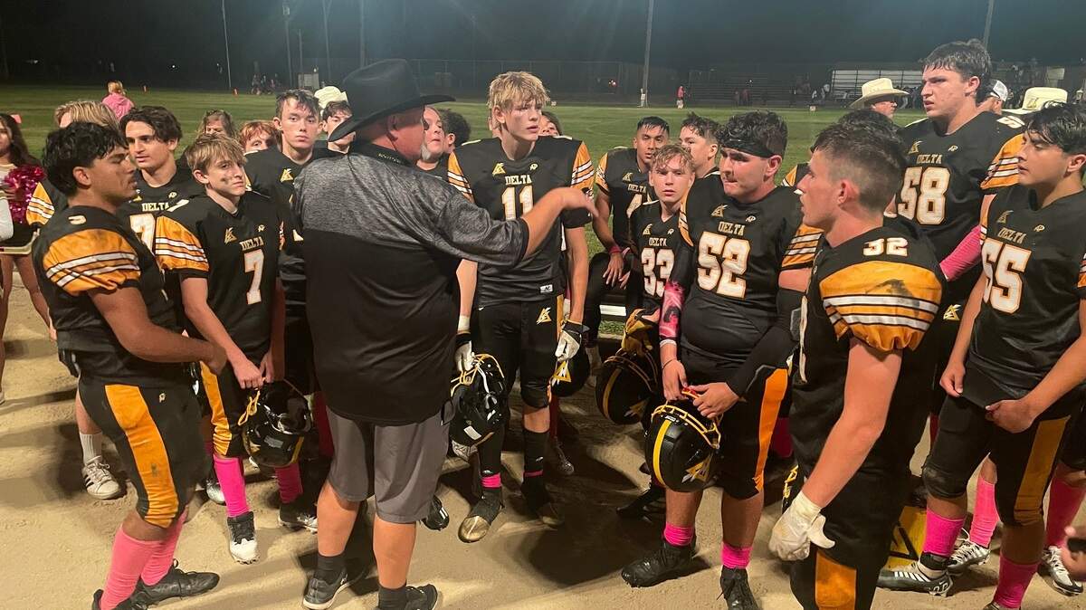 Delta Saints coach Tim Rapp congratulates his team for a 50-26 win over Mira Loma on Friday as Gavin McAllister accounted for five touchdowns in honor of his late brother.