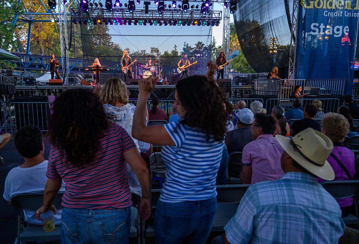 Audience members dance to Petty & the Heartshakers, a Tom Petty tribute band, Thursday, July 18, 2019, at the California State Fair.