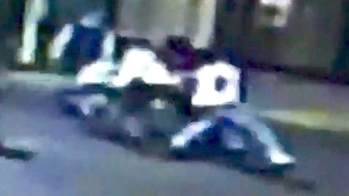 In this cropped screen capture of a surveillance video pointed at 21st and K streets in midtown Sacramento early Thursday, Oct. 8, 2015, Spencer Stone, believed to be the man in a white shirt in the center taking a swing in this frame, is seen fighting two unknown men. A man in a white shirt on the right is believed to be stabbing Stone in this frame. 