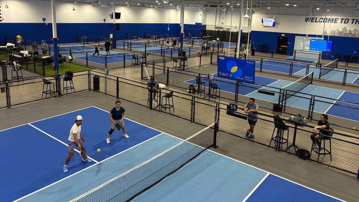 Pickleball players enjoy a new indoor court at Pickleball Kingdom Roseville on Tuesday morning, April 7.