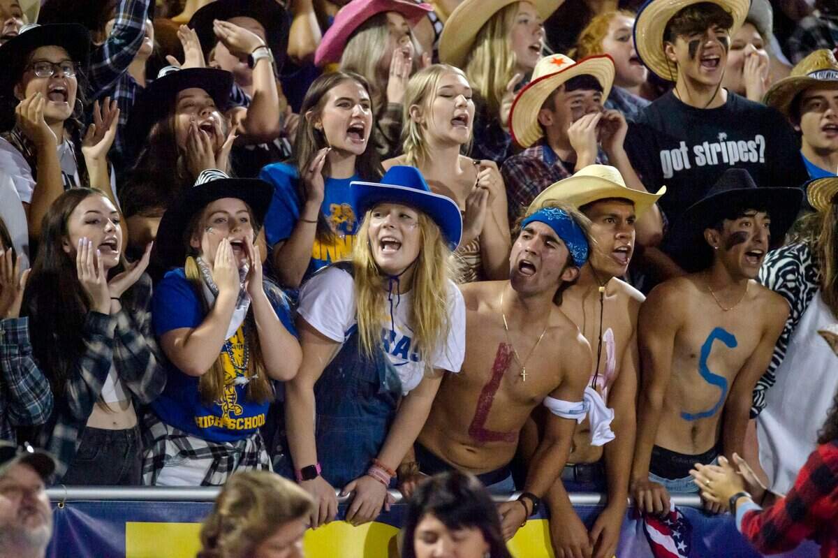 Lincoln Fighting Zebras fans cheer on their team during the game against Elk Grove at Lincoln High School in Lincoln on Friday, Sept. 17, 2021. Elk Grove won 49-23.