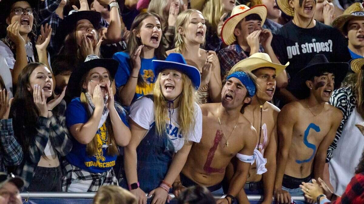 Lincoln Fighting Zebras fans cheer on their team during the game at Lincoln High School in Lincoln on Friday, Sept. 17, 2021. Elk Grove won 49-23.
