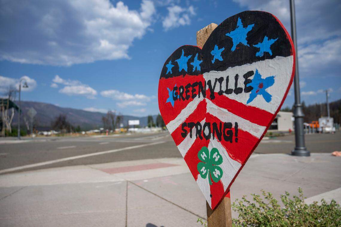 A sign that reads “Greenville Strong!” is seen in downtown Greenville on Thursday, July 28, 2022, a year after the Dixie Fire devastated the community.
