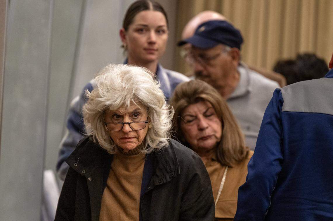 Maria Kelly, an opponent of a proposed six-story apartment complex in East Sacramento, leaves the Sacramento City Council meeting after the project was approved on Tuesday.