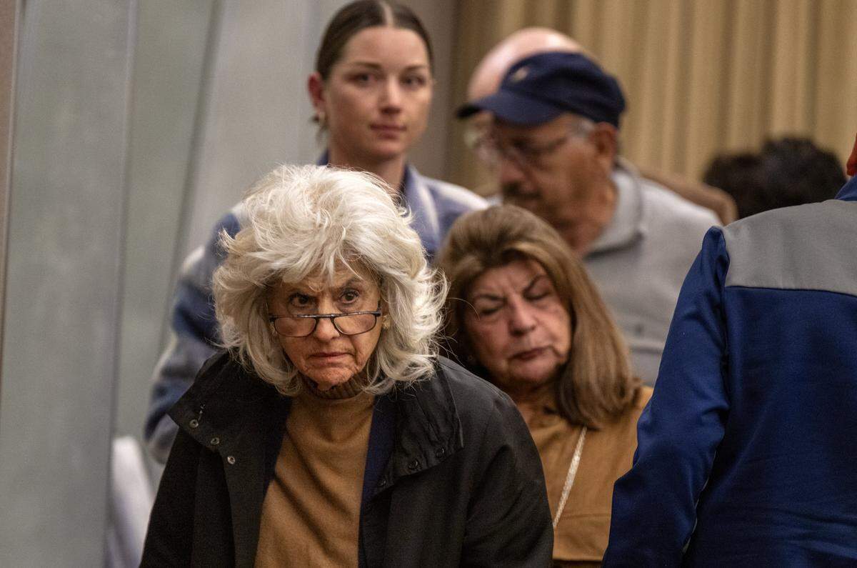 Maria Kelly, an opponent of a proposed six-story apartment complex in East Sacramento, leaves the Sacramento City Council meeting after the project was approved on Tuesday.
