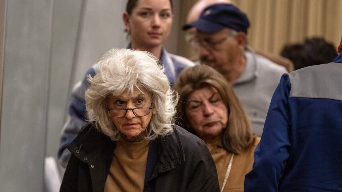 Maria Kelly, an opponent of a proposed six-story apartment complex in East Sacramento, leaves the Sacramento City Council meeting after the project was approved on Tuesday, April 28, 2026.