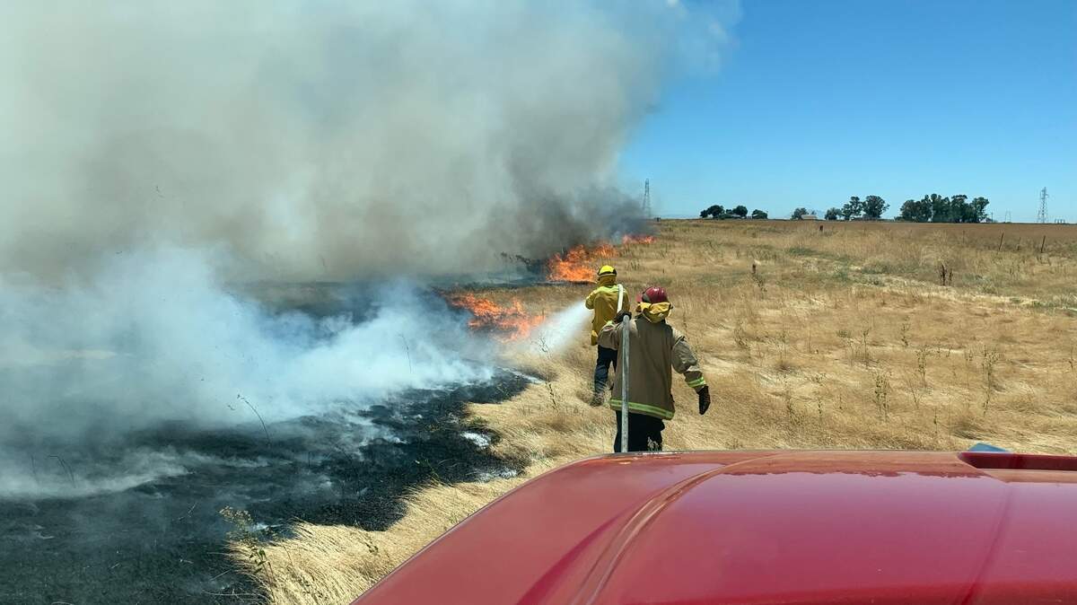 A vegetation fire burns several miles south of Davis on June 28, 2022.